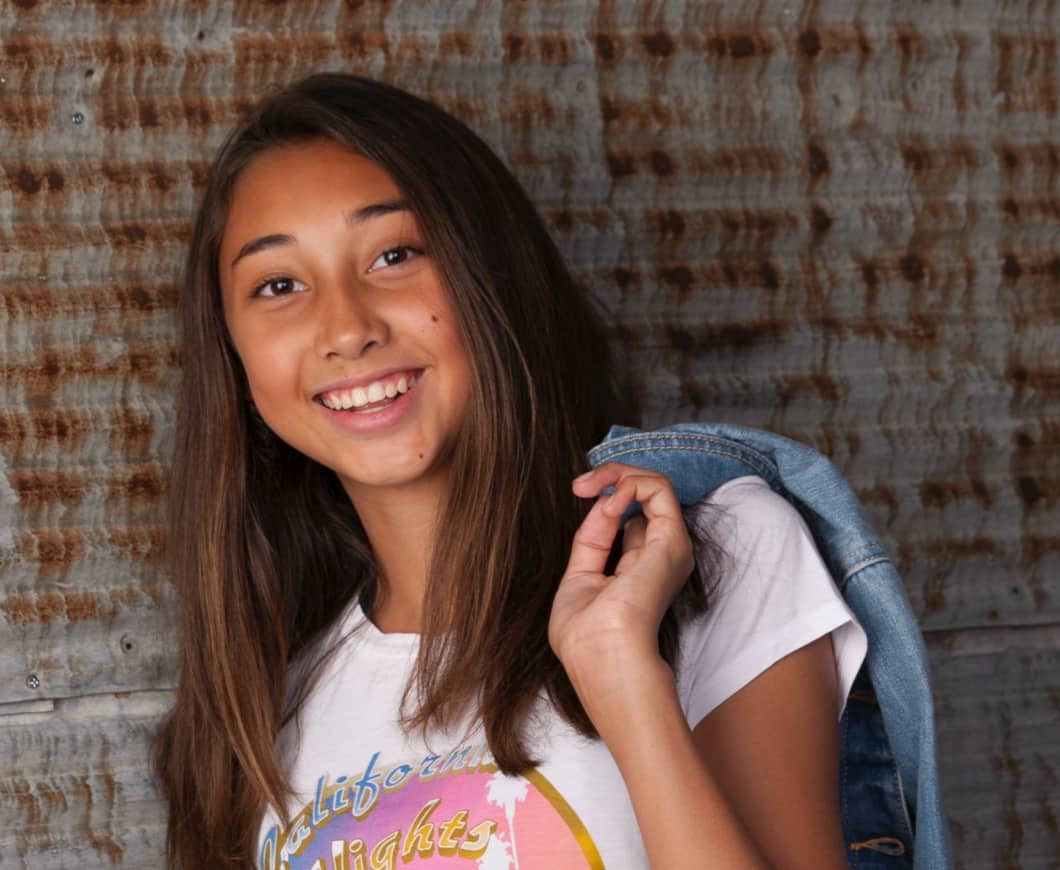teen girl smiling with straight teeth