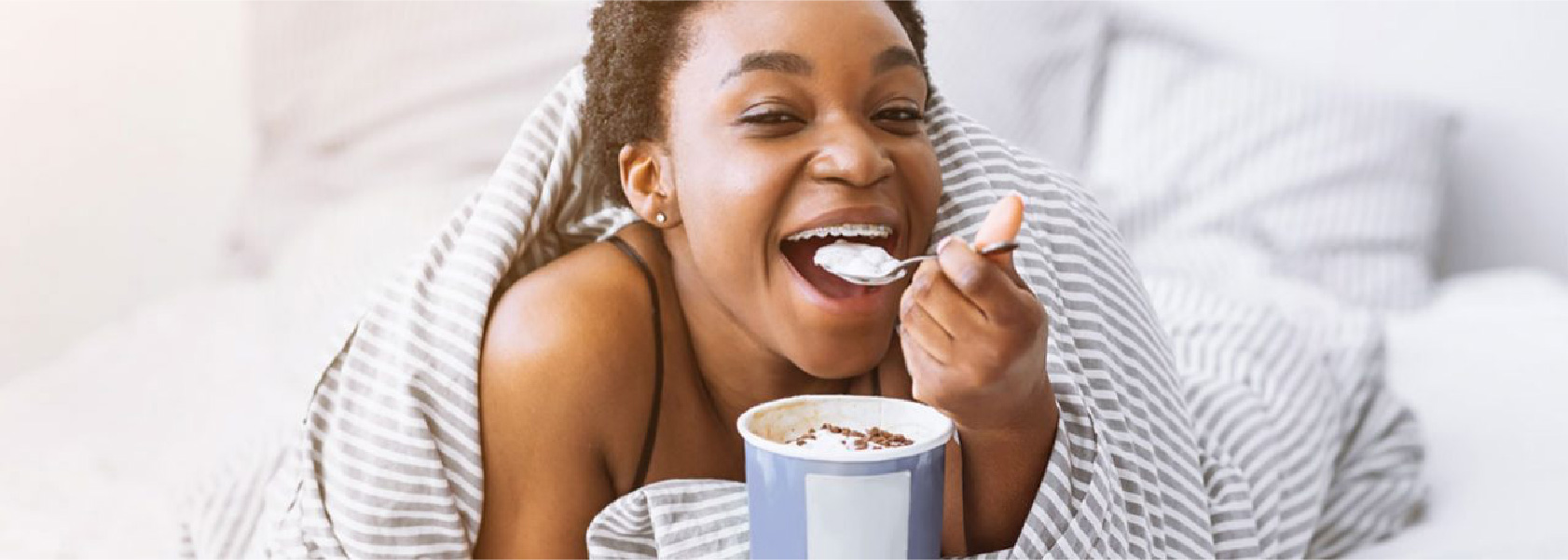  Braces-Friendly Foods. Girl Eating Ice Cream With Braces On.