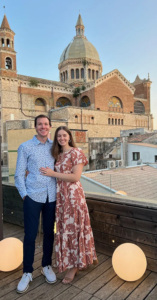 Dr. Adam Hoxie and his wife standing together and smiling