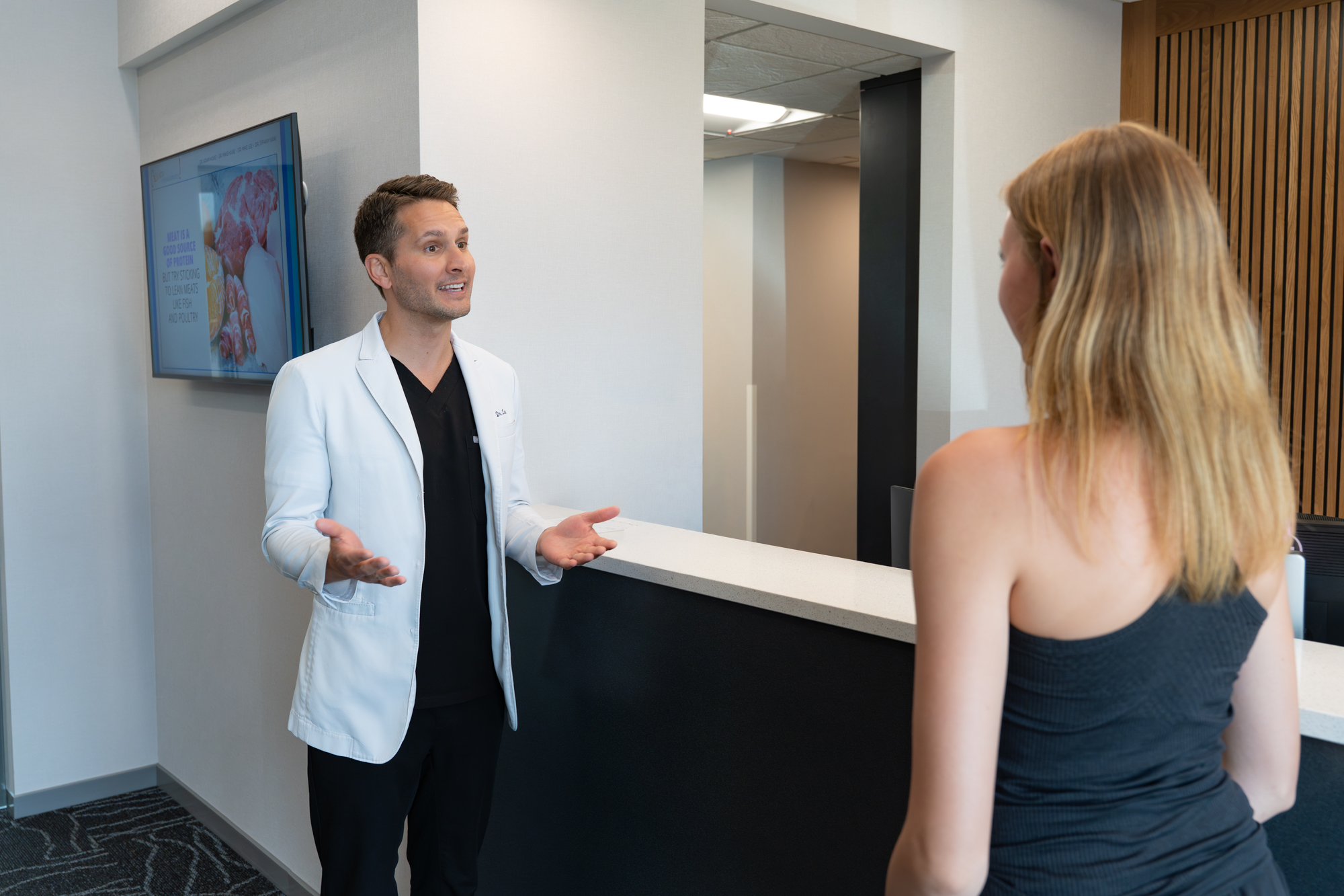 Ovation Orthodontics orthodontist at the reception counter